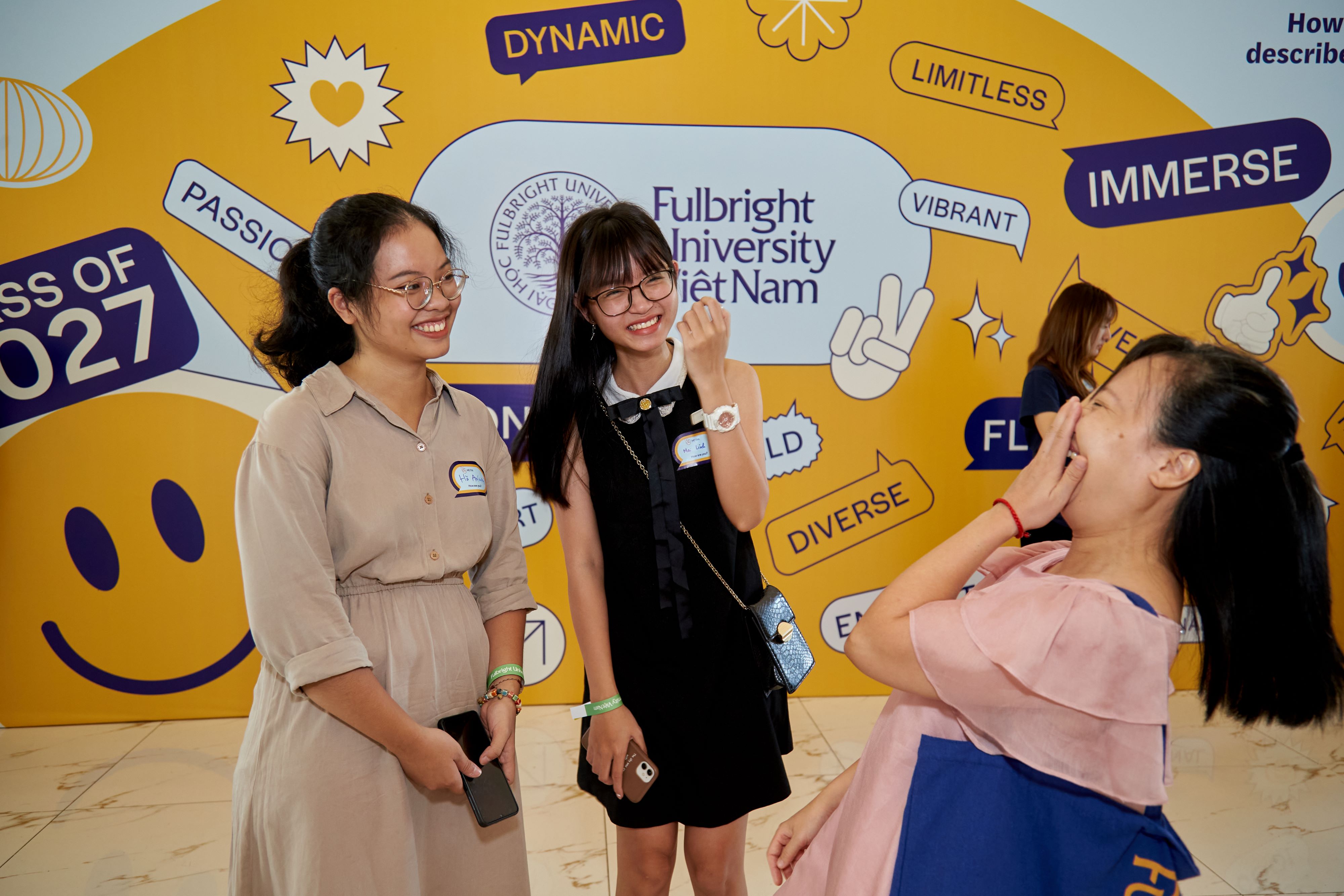 Fulbright alumni and teacher conversing on Fulbright Convocation Day