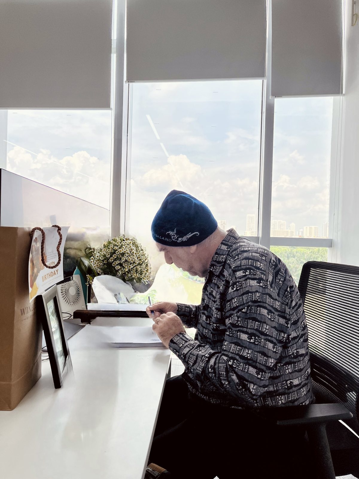 Steve writing at his desk