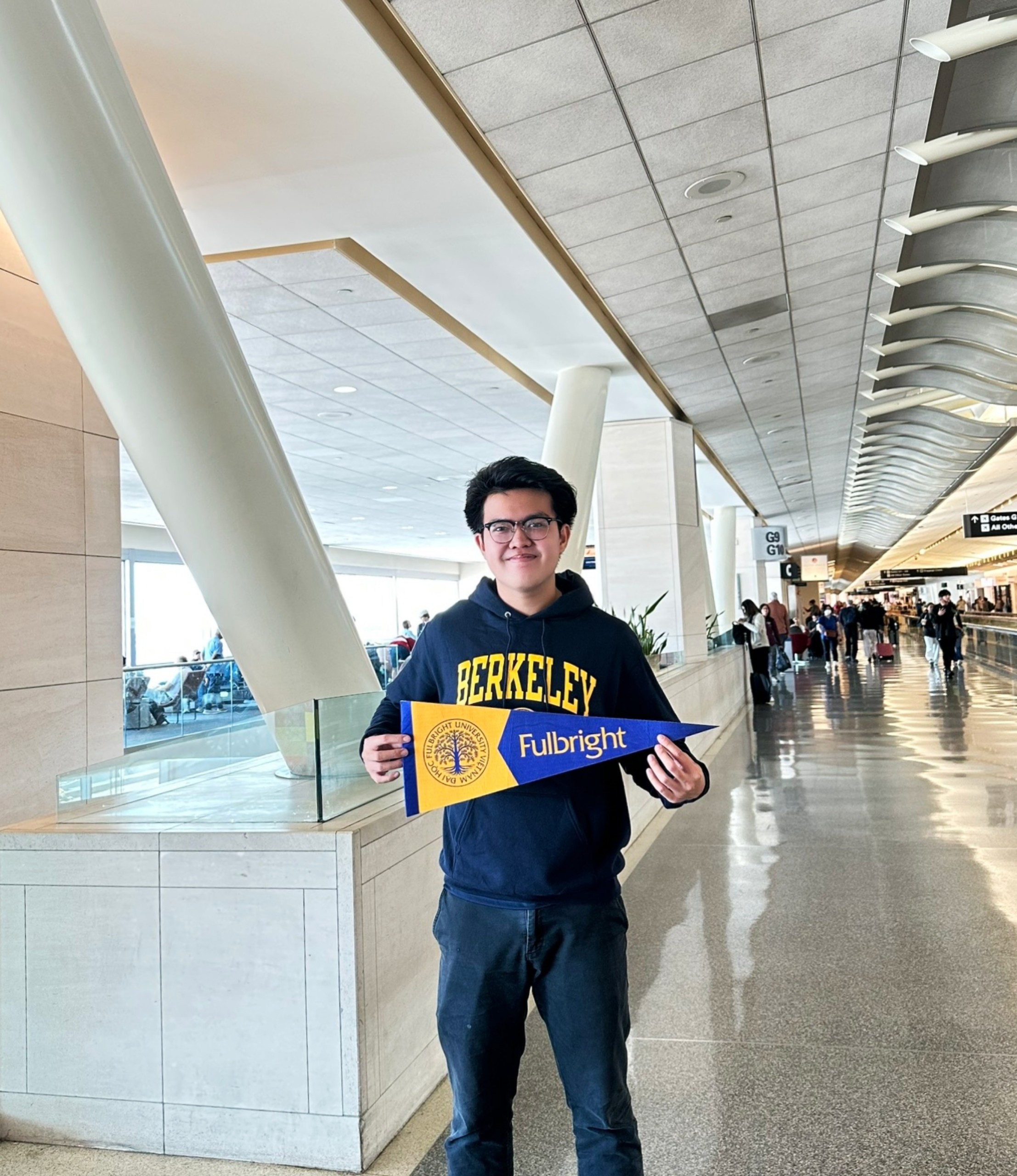 Kien and his Fulbright pennant at the San Francisco Airport